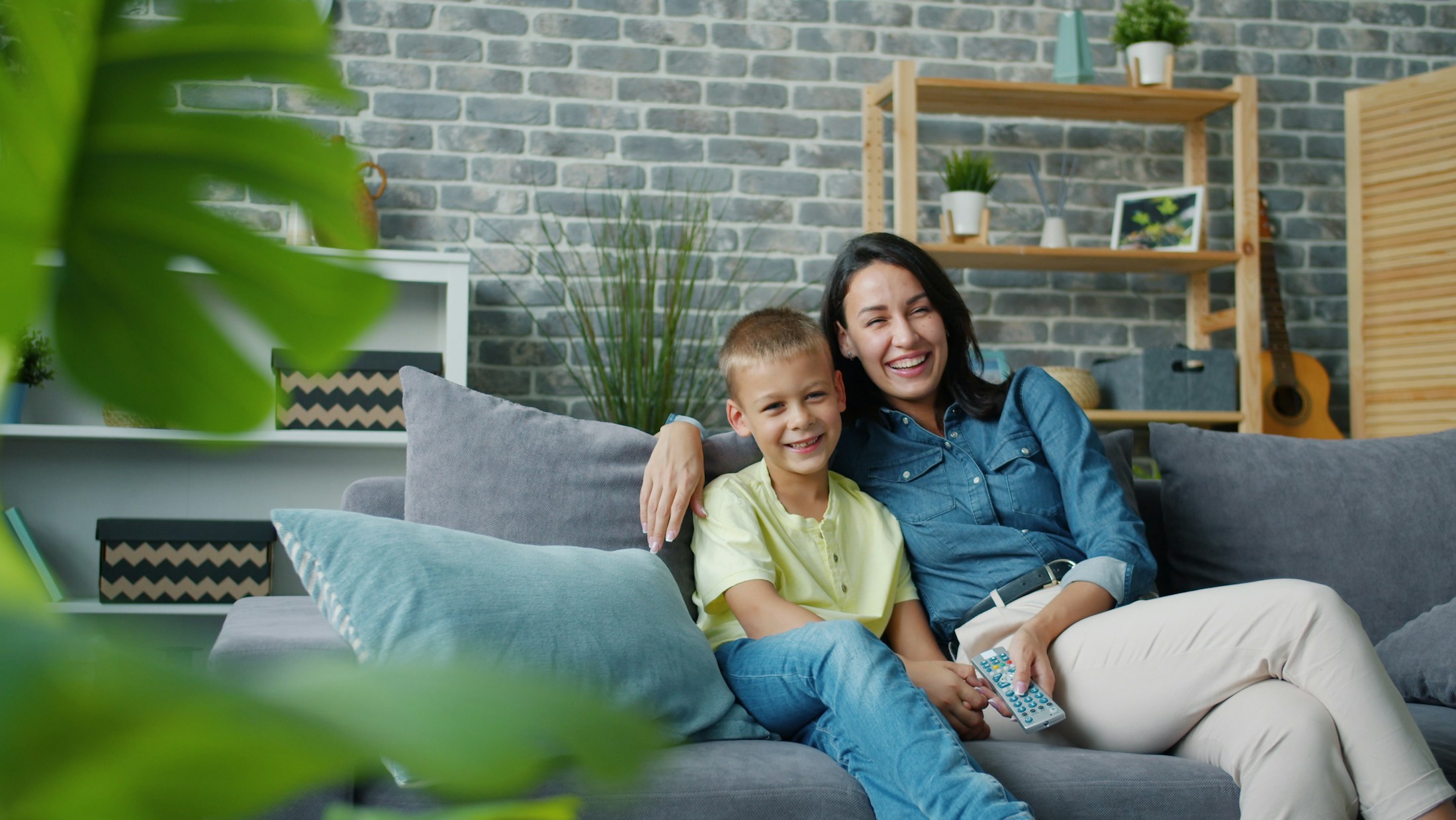 Parent and child relaxing together at home